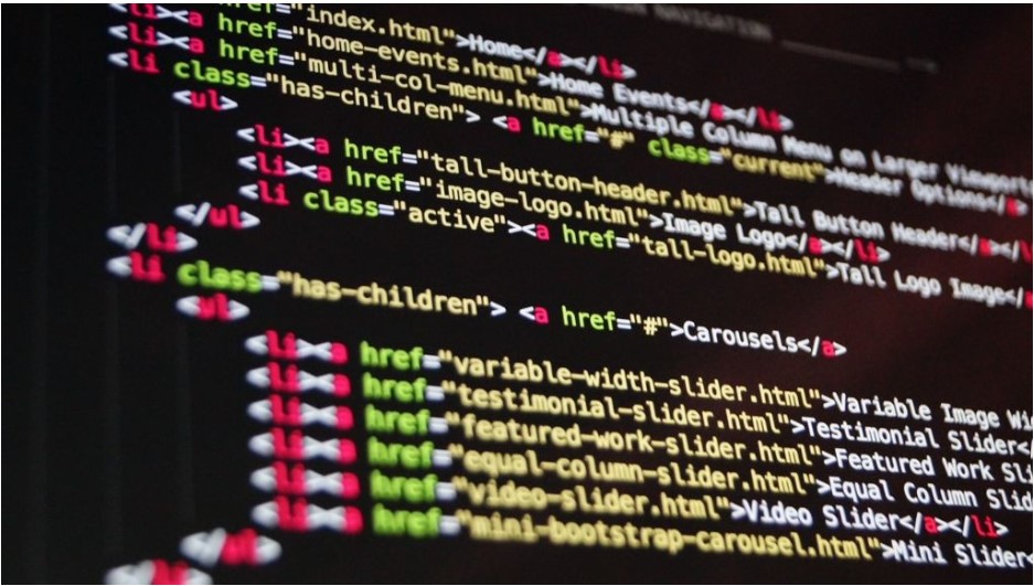 Black screen with HTML code in various colors.