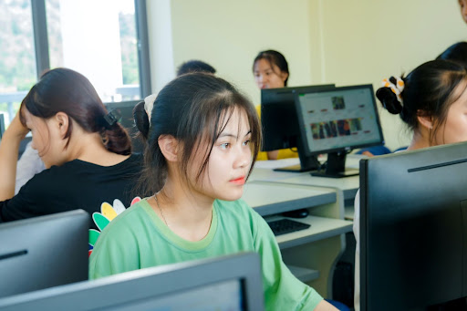 Student looking at a laptop in a computer lab