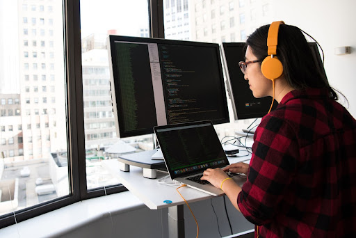 girl coding on a desktop