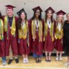 Picture showing few girls and boys in their graduation dresses