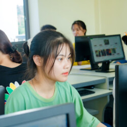 Student looking at a laptop in a computer lab
